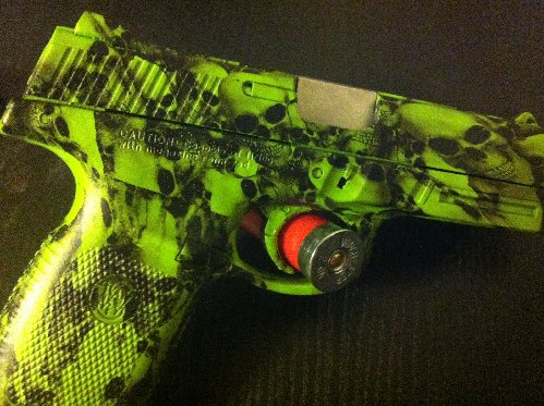 Pistol dipped in skulls.JPG