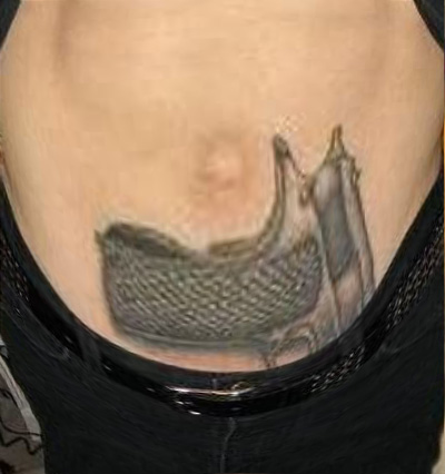 gun-tattoo-on-waist beer belly.jpg